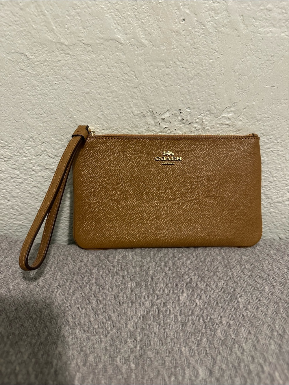 Like New Coach  Leather Tan Wristlet Pouch with Gold Logo